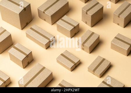Lots of cardboard boxes pattern on brown background. Stock Photo