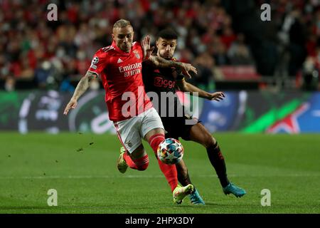 Lisbon, Portugal. 23rd Feb, 2022. Everton of Benfica (L) vies with Noussair Mazraoui of Ajax during the UEFA Champions League round of 16 1st leg match between SL Benfica and AFC Ajax in Lisbon, Portugal, Feb. 23, 2022. Credit: Petro Fiuza/Xinhua/Alamy Live News Stock Photo