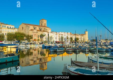 Yachts reflecting in blue water in the old town port of La Ciotat, Marseilles district, France, in the evening light Stock Photo