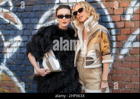 Mary Leest and a guest outside of Fendi fashion show during the Milan Fashion Week Fall/Winter 2022/2023 on February 23, 2022 in Milan, Italy Stock Photo
