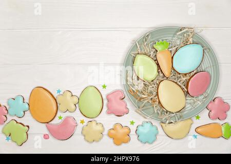 Beautiful glazed Easter cookies on white background with copy space. Stock Photo