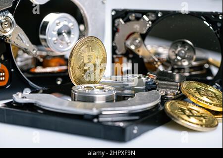 Bitcoin BTC on an open hard drive, cryptocurrency business concept, close-up Stock Photo