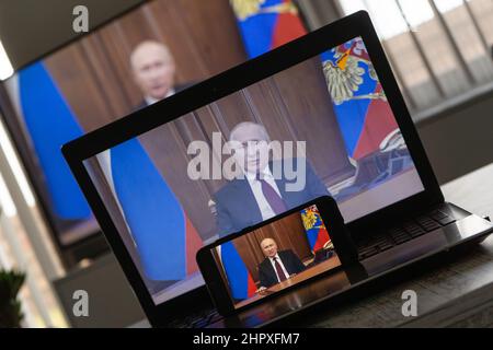 Watching Vladimir Putin on TV. President of Rusia Vladimir Putin declares war to Ukraine Stock Photo