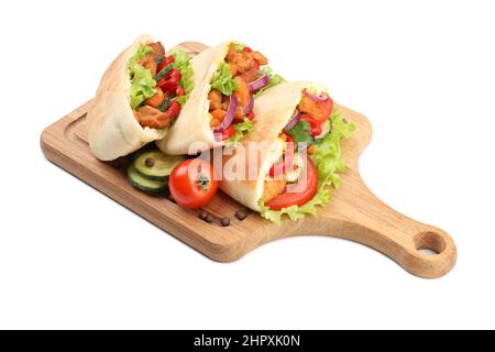 Board with pitas with chicken meat isolated on white background Stock Photo