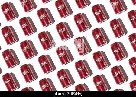 Dr. Pepper cans pattern with hard shadow on white background. Stock Photo