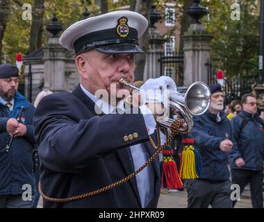 Close up of man blowing a bugle with the Corps of Drums Society march at the Lord Mayor’s Show 2021, Victoria Embankment, London, England, UK. Stock Photo