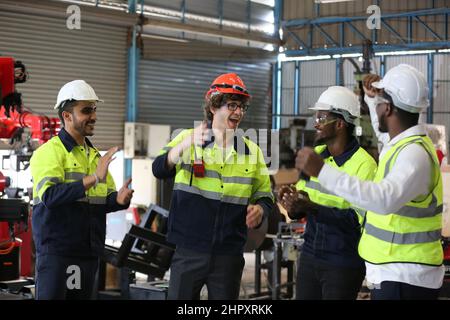Factory Engineer Operating machines in industry factory. Stock Photo
