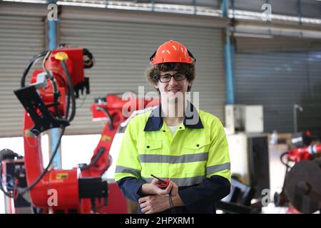 Factory Engineer Operating machines in industry factory. Stock Photo