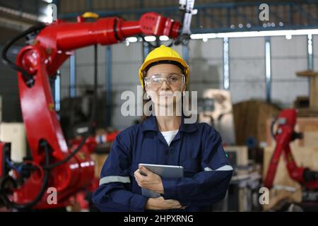 Factory Engineer Operating machines in industry factory. Stock Photo