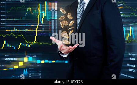 Bitcoins falling in to Businessmans hands. Cryptocurrency and banking concept Stock Photo
