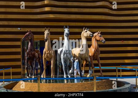 A fountain sculpture featuring Akhal-Teke horses outside the Turkmenistan Pavilion in the Mobility district at the Dubai EXPO 2020 in the UAE. Stock Photo