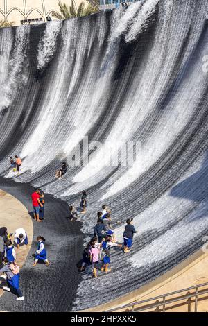 Visitors enjoying the surreal water feature in Jubilee Park at Dubai Expo 2020, United Arab Emirates. Stock Photo