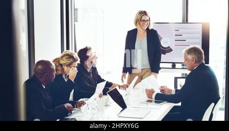 These presentations are always pleasant. Cropped shot of an attractive young businesswoman giving a presentation in the boardroom. Stock Photo