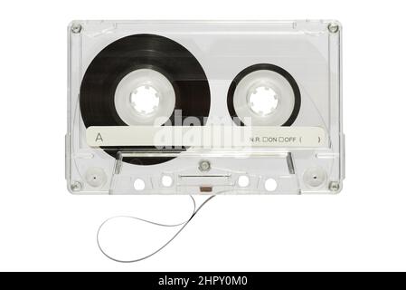 Vintage audio cassette tape with transparent plastic case and black tape on reels isolated on white background in light studio Stock Photo