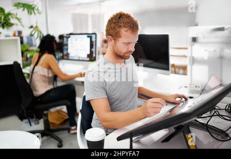 Smart technology makes everything easier. A young man working on a large touchscreen. Stock Photo