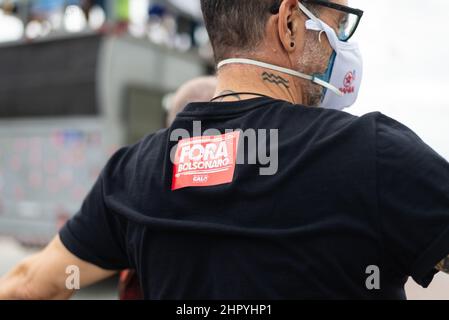Closeup shot of stickers on a Brazilian's shirt protesting President Jair Bolsonaro Stock Photo