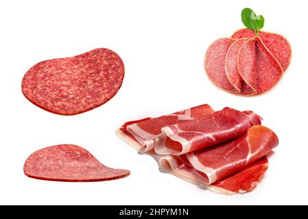 Falling tasty salami isolated on white background. Stock Photo