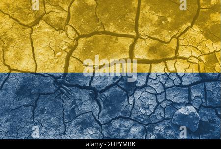 Ukrainian national flag pattern cracked earth, war concept Stock Photo