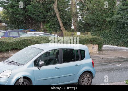 London UK 24 February 2022 . UK weather. Sudden rain, hail, sleet, snow and sunshine beating down at Blackheath village South East London England UK.Credit: Xiu Bao/Alamy Live News Stock Photo