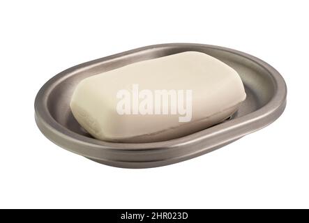 Bathroom: bar of natural white soap in a soap plate, metallic, isolated on white background.  Stock Photo