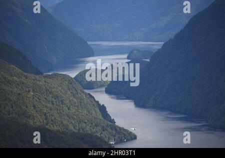 Panoramic overview of the remote and beautifully misty Doubtful Sound fjord in far South West New Zealand. Stock Photo