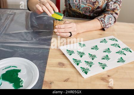 process of printing with wooden stamps. workshop Stock Photo