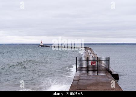 Presque Isle Harbor Breakwater Lighthouse as seen from Marquette Michigan in the fall on Lake Superior Stock Photo