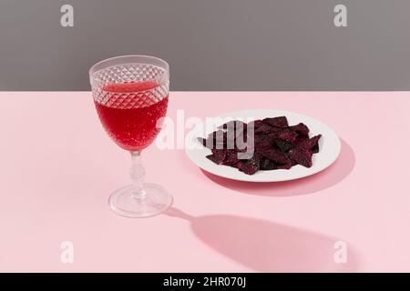 Dried dragon fruit and drink on pink tabl Stock Photo