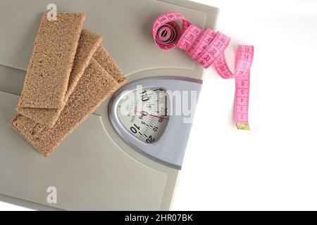 Two pieces of rye bread are weighed on a kitchen scale. Diet Stock Photo -  Alamy