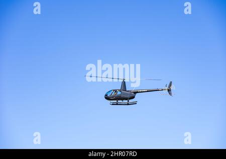 The Robinson R44 Raven II helicopter with registration LN-OKK in flypast on South Koster Island, Bohuslän, Sweden, August 11, 2016. Stock Photo