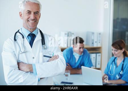 My team and I are on top of our game. A group of healthcare workers standing and smiling at the camera. Stock Photo