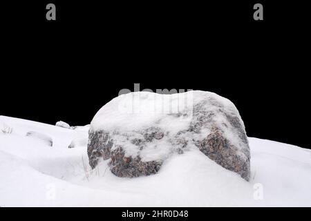 natural stone in snow isolated on black background. High quality photo  Stock Photo - Alamy