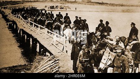 World War I  - Russian cavalry attempting to cross a war damaged woodenbridge Stock Photo