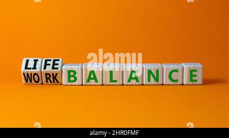 Work life balance symbol. Turned wooden cubes and changed concept words ...