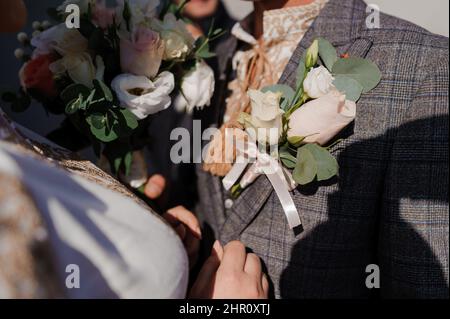 Boutonniere on the groom's jacket Stock Photo