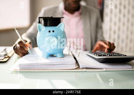 Student Loan. Accounting Teaching Advisor And Graduate Cap Stock Photo