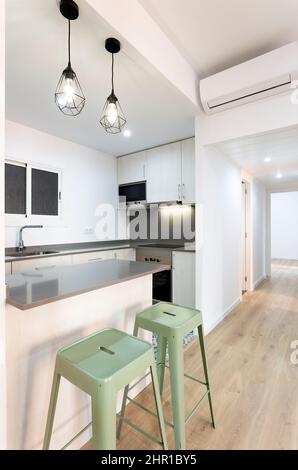 small kitchen open to the living room Stock Photo