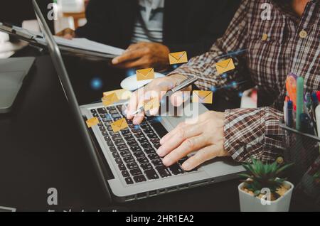 hand business man typing on a computer keyboard.Marketing business sending information to customers or hacking online transactions. Business concept t Stock Photo