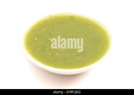 Small Bowl of Green Salsa Verde Isolated on a White Background Stock Photo
