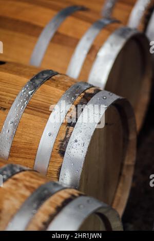 hydrating whiskey barrels with water before filling with liquor Stock Photo