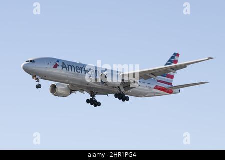 SeaTac, WA, USA - February 23, 2022; American Airlines 777-200 landing with wheels down on flight from London Heathrow to Seattle Stock Photo