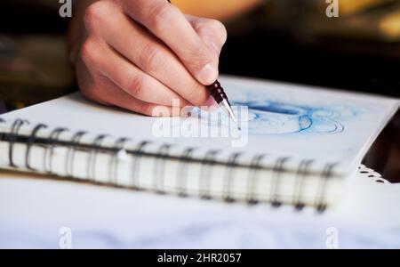 Getting lost in creativity. A close up of a tattoo artists latest design whilst he still drawing it. Stock Photo