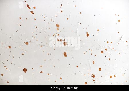 The texture of the ceiling with splashes of brown paint. Front view.  Stock Photo