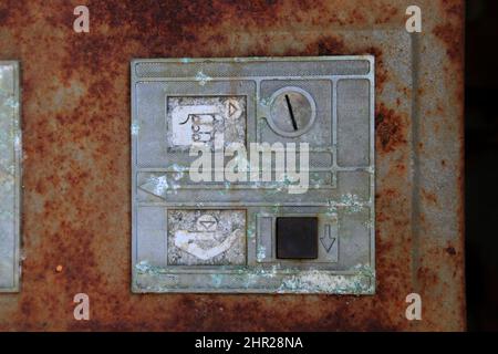 Ukraine, in the restricted and uninhabitable 30 kilometer zone around the Chernobyl power plant and the Pripyat labor camp, Coin slot at the machine f Stock Photo