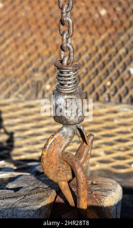A rusted hook and chain in South Australia Stock Photo