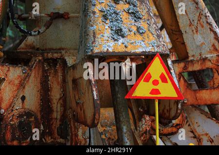 Ukraine, in the restricted and uninhabitable 30 kilometer zone around the Chernobyl power plant and the Pripyat labor camp, Warning signs for radioact Stock Photo