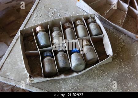 Ukraine, in the restricted and uninhabitable 30 kilometer zone around the Chernobyl power plant and the Pripyat labor camp, bottles Stock Photo