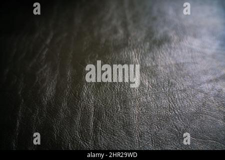 Genuine black vegetable tanned leather crafts background, Cowhide leather Stock Photo