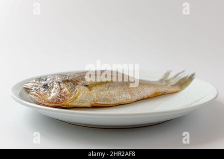 dried yellow croaker on a white background Stock Photo