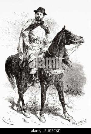 Argentinian gaucho riding a horse, Uspallata, Argentina. South America. Through the Pampas and the Cordillera, from Montevideo to Santa Rosa (Chile) by Desiré Charnay, 1876 Stock Photo